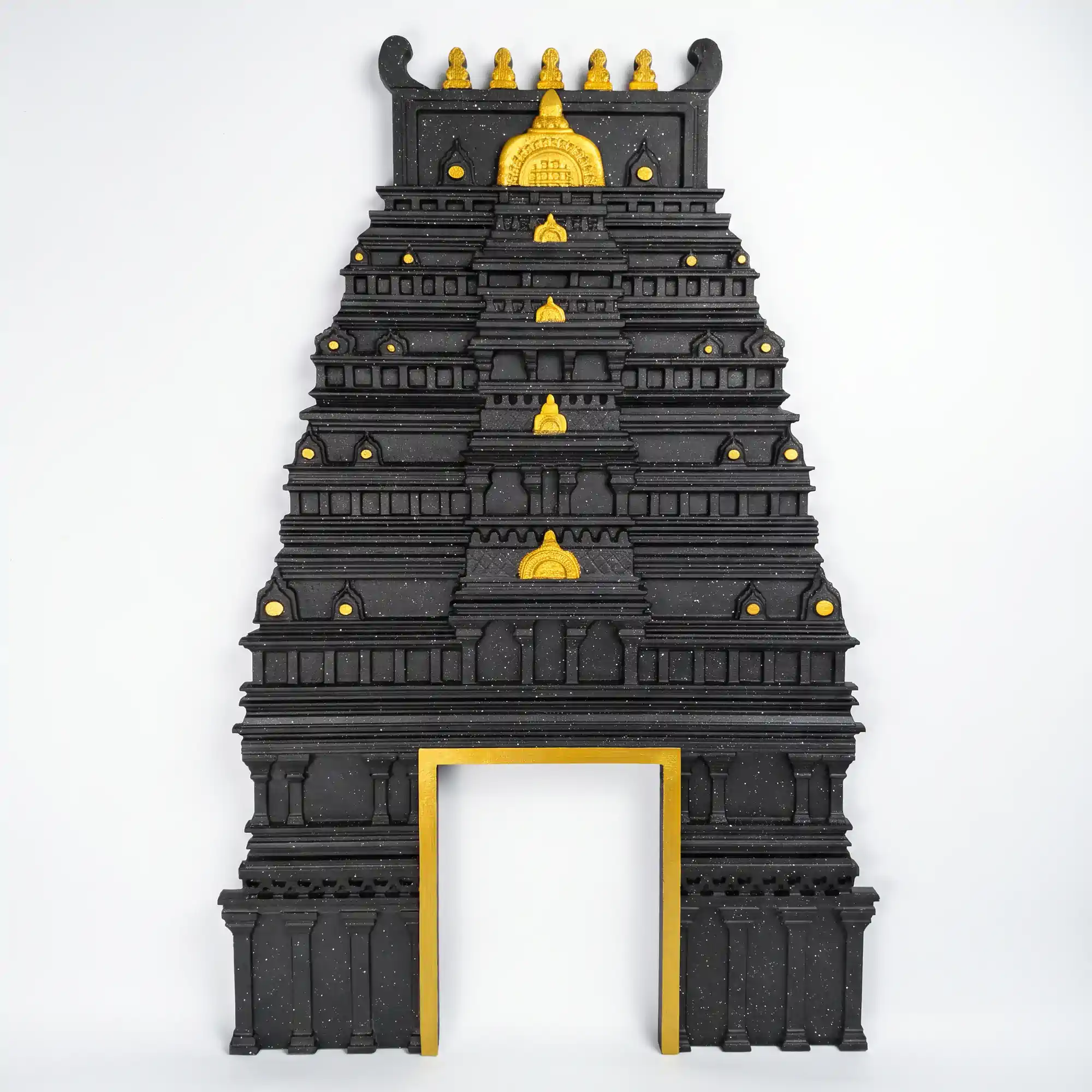 Black south indian gopuram with gold accent