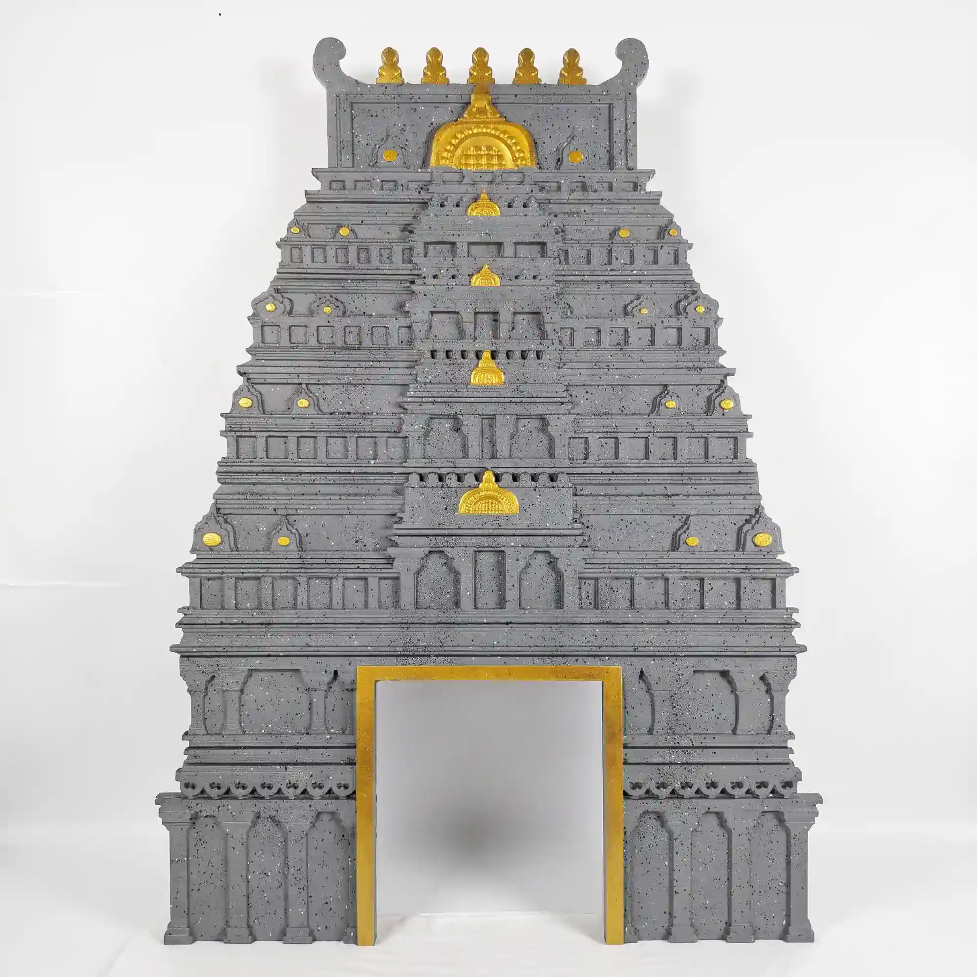 Light grey south indian gopuram with gold accent