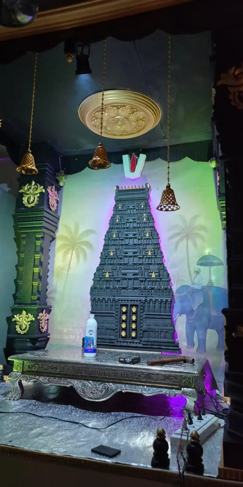 Rawdius Gopuram Customer Installation Pooja shrine setup in progress featuring a dark gopuram wall decor backdrop