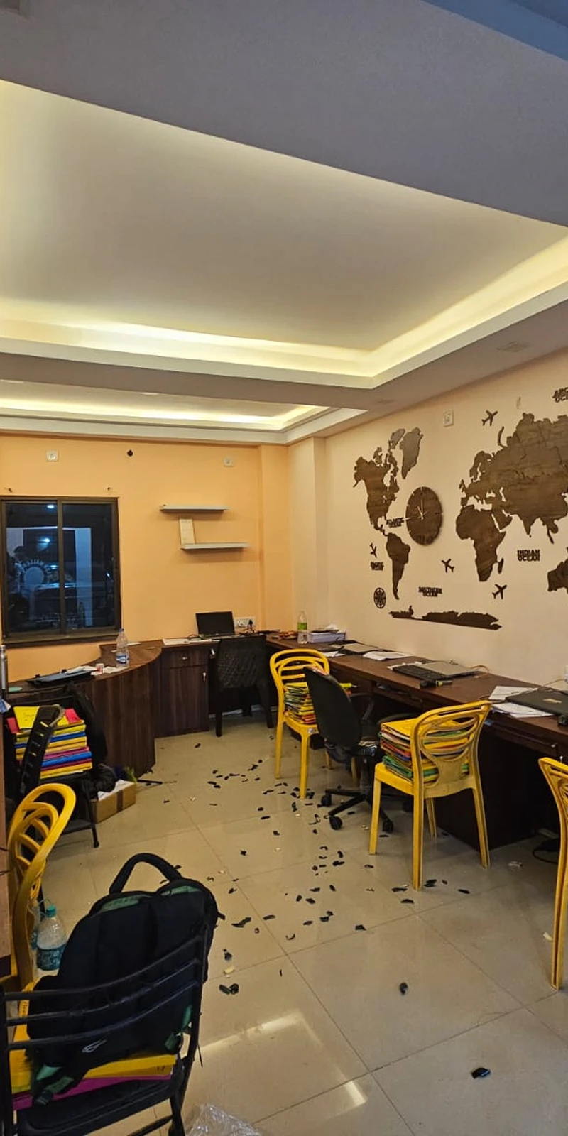 Rawdius Mirror Customer Installation Wooden world map wall art displayed on a peach wall in an office space